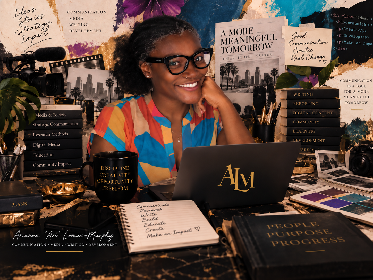 Arianna Lomax-Murphy smiling at the camera while working at her desk with a laptop and creative workspace